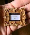 Ribbon wisdom in a gold frame